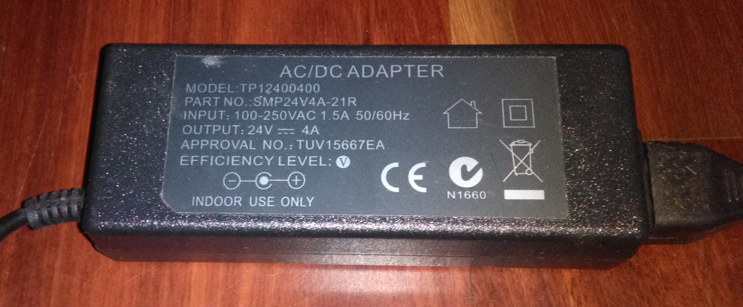 A unbranded 24V 4A DC power supply. It has several worthless certification symbols on it.